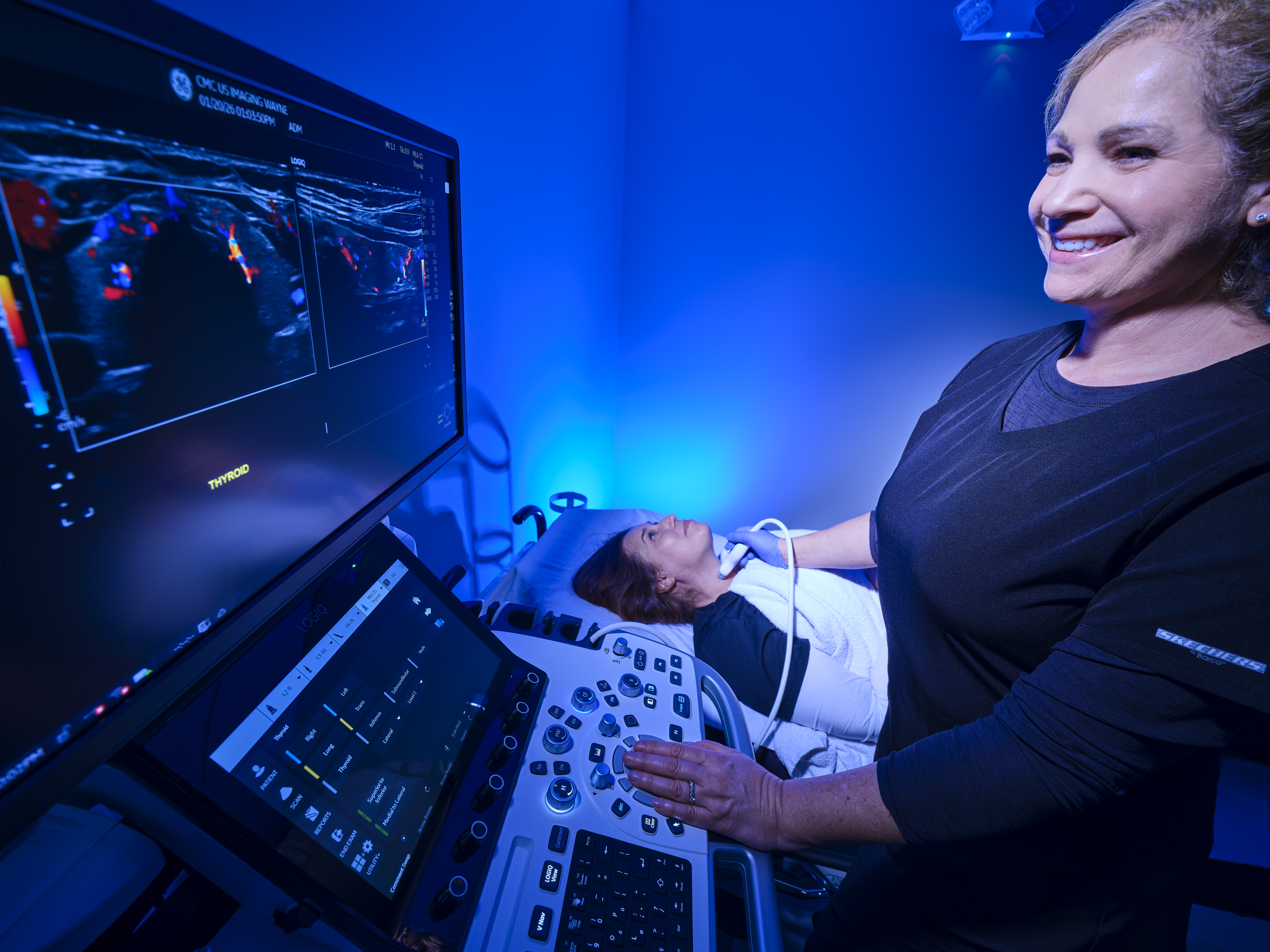 Clinician performing an ultrasound.