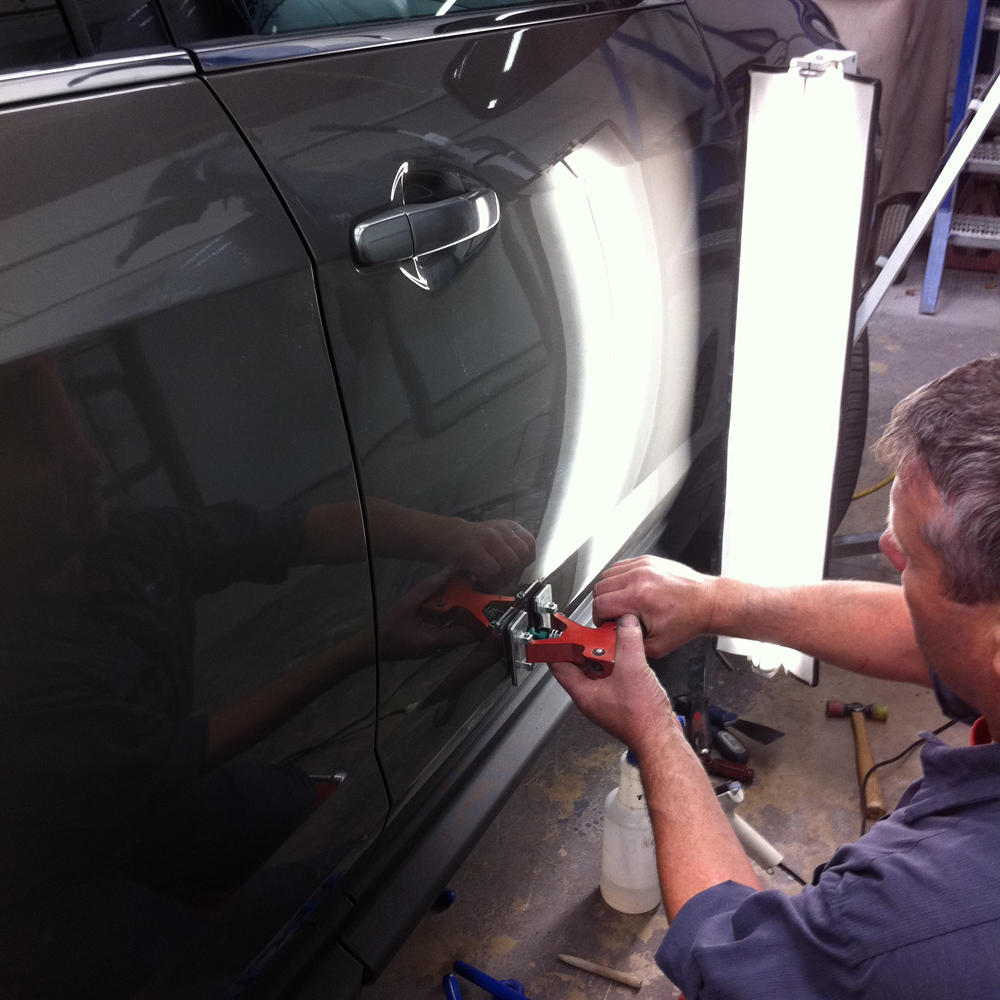 The most common practical use for Paintless Dent Repair (PDR) is the repair of hail damage, door dings, minor body creases, and minor bumper indentations. The techniques can also be applied to help prepare the damaged panel for paint. Let American Auto Body help today!