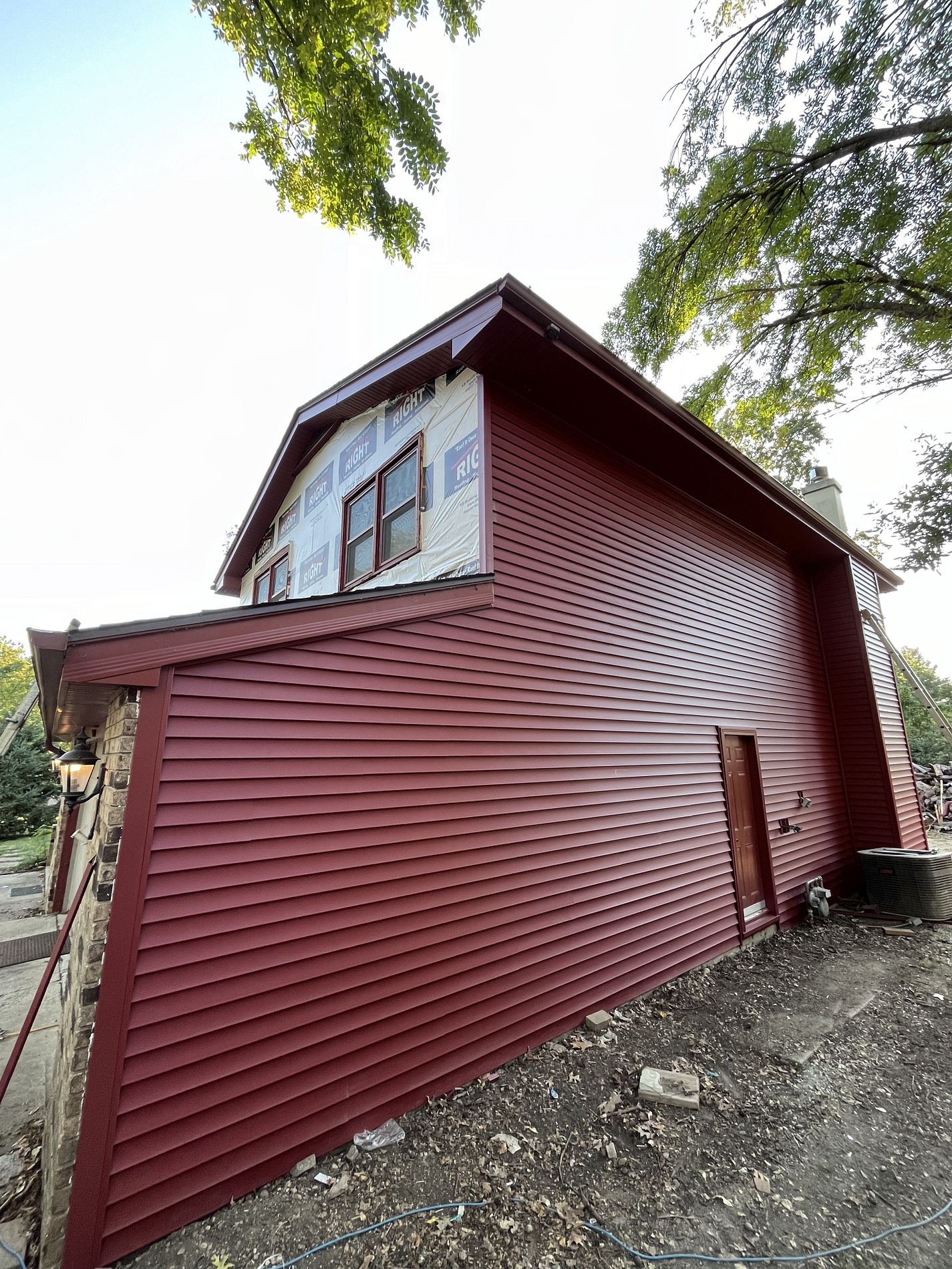 Vinyl Siding Installation in Lighthouse Red in West Des Moines, IA