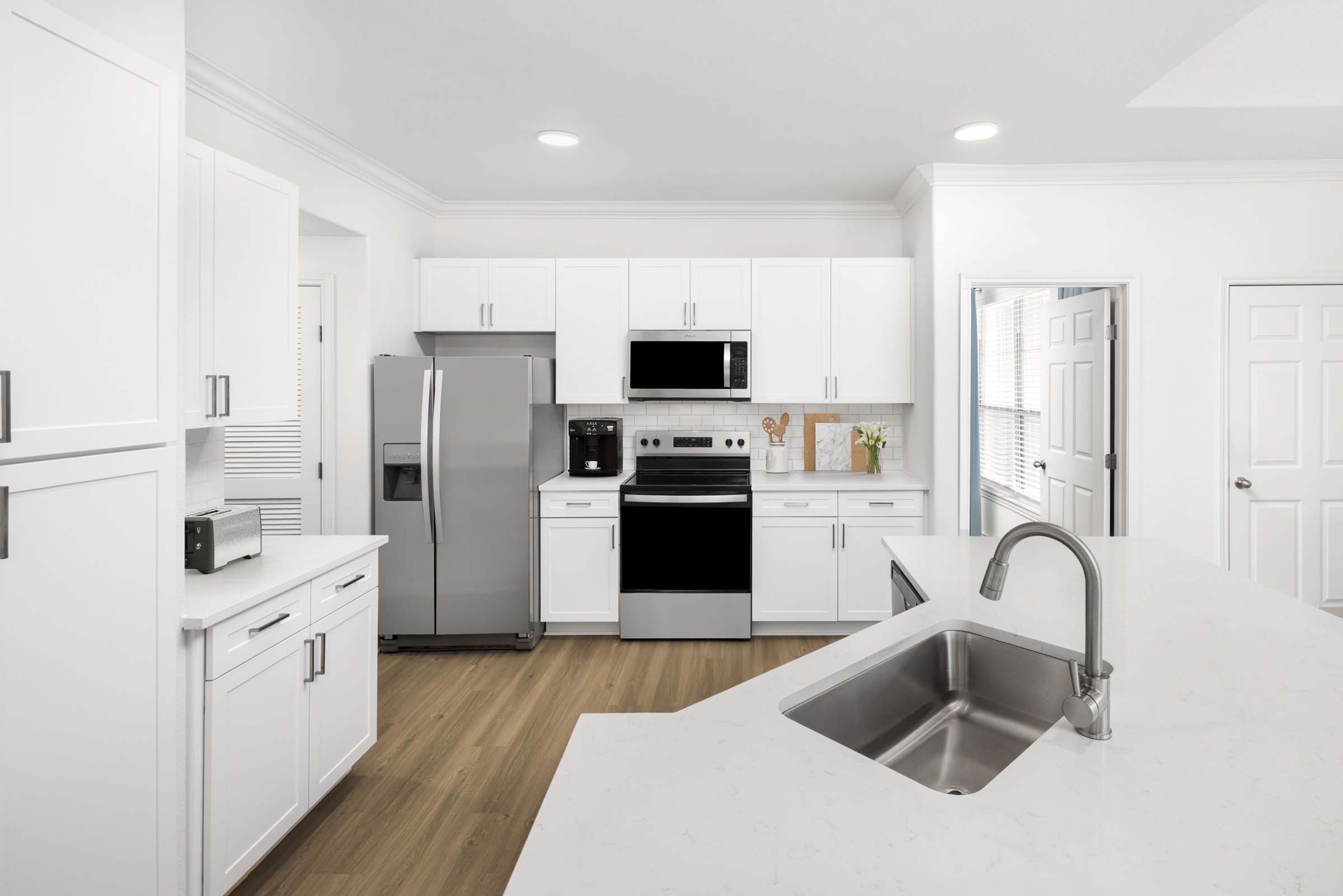 Camden Northpointe kitchen with stainless steel appliances and white cabinetry