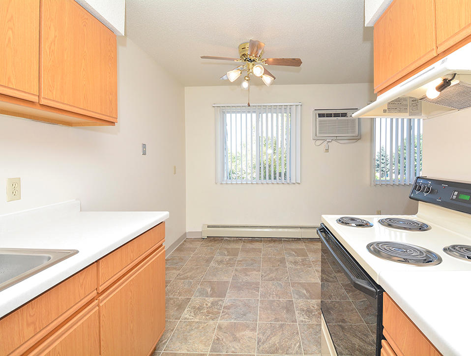 Fully-Equipped Kitchen With Adjacent Dining Room Area