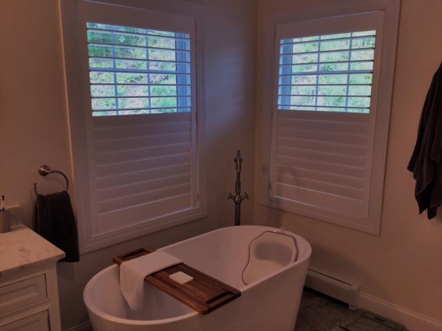 Privacy is a must for your master bathroom, and these Composite Shutters are the perfect fit. These Croton on Hudson, NY, homeowners love the look of their recent installation! #BudgetBlindsOssining #CrotonOnHudsonNY #CompositeShutters #MoistureResistantShutters #FreeConsultation #WindowWednesday