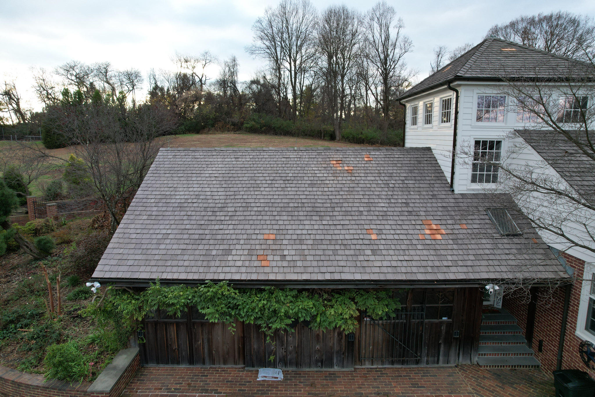 a roof with shingles repaired by Class Roofing