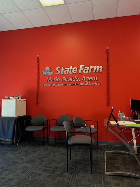 Celebrating the holidays at Mario Giraldo's State  Farm office!