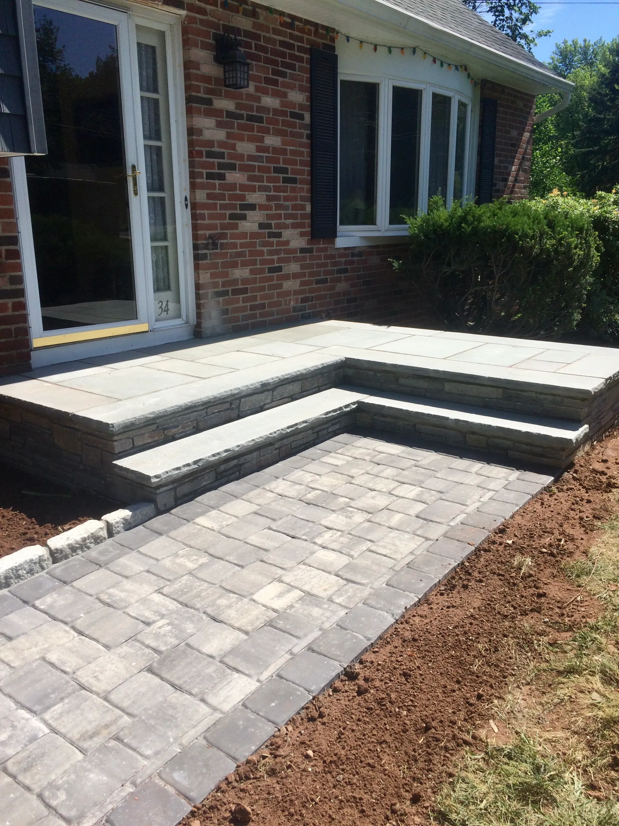 Wide paver walkway - Walkways and pathways project by General Masonry LLC.