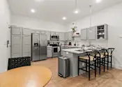A Kitchen With Fridge at G at Market Apartments, Bentonville, Arkansas