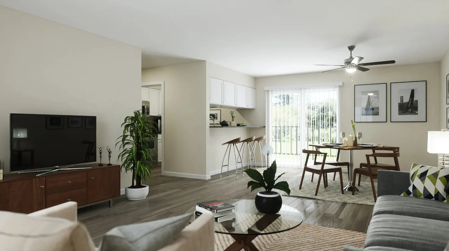 A living room with a television, a dining table, and a ceiling fan
