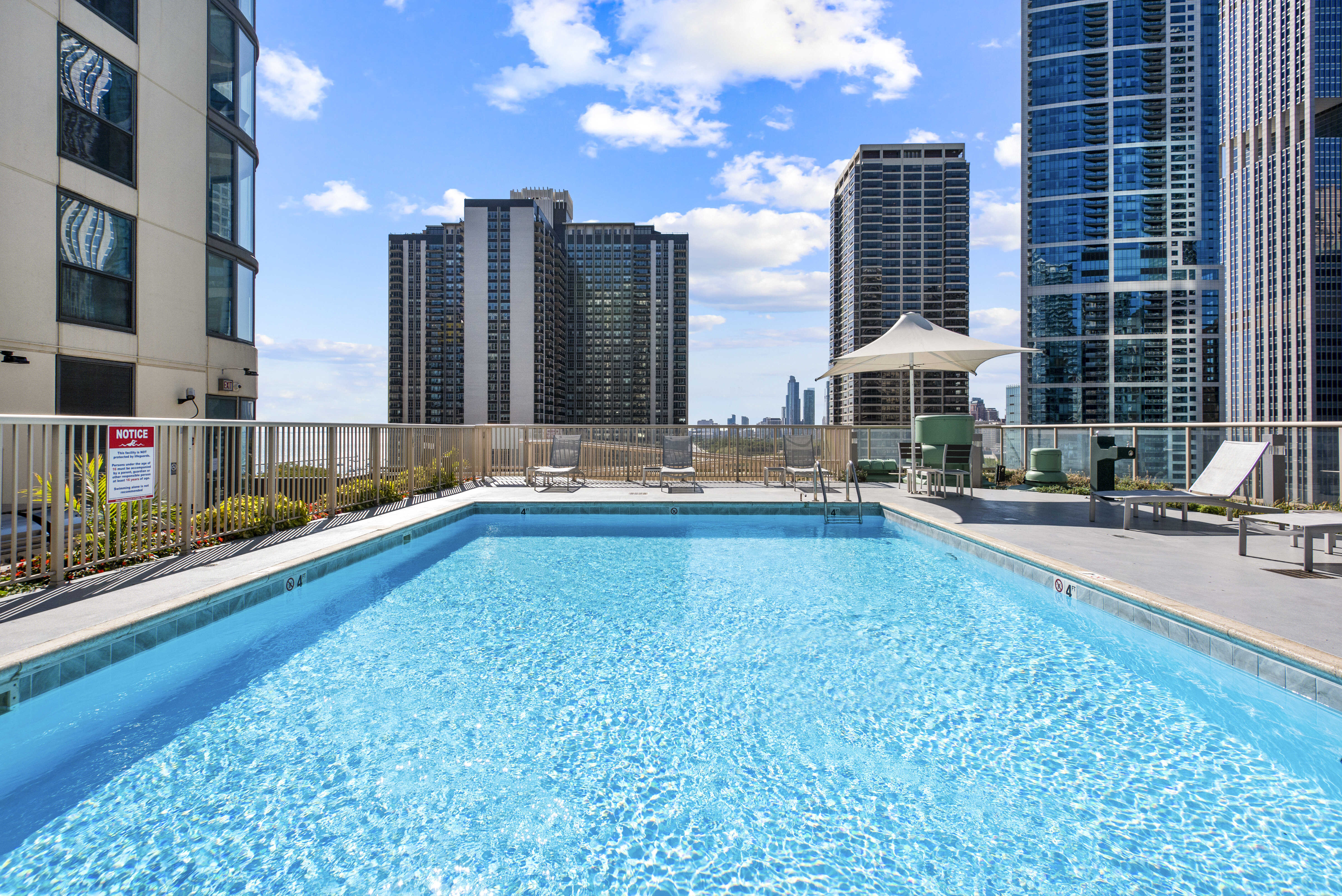 Shoreham & Tides Apartment Pool With Skyscraper Background