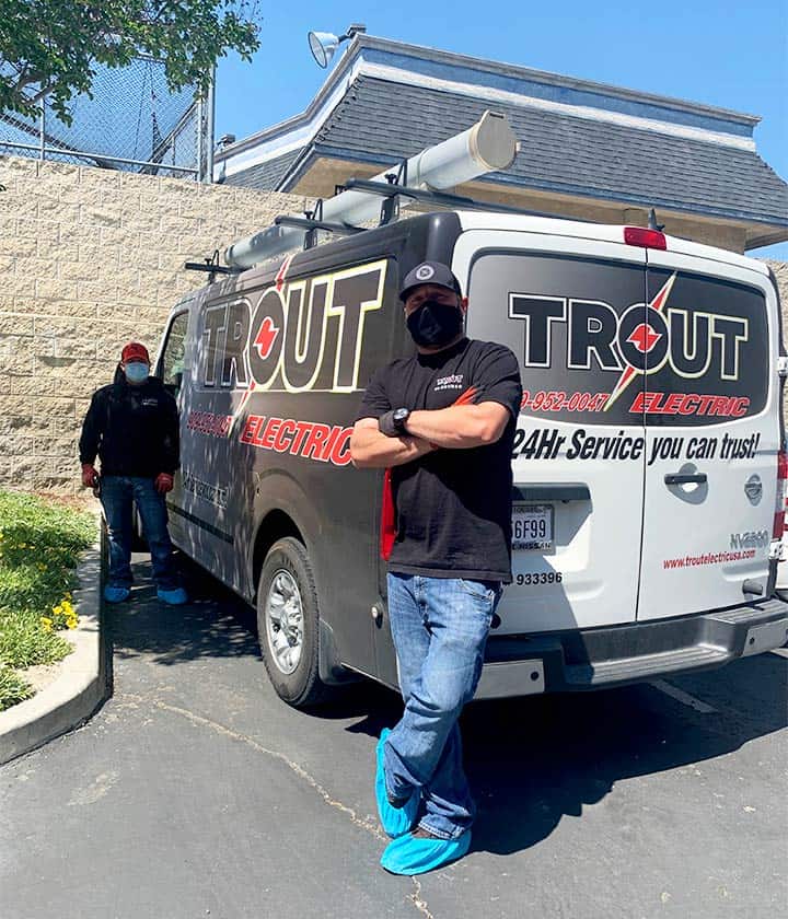 Trout Electric service van with two of our electricians