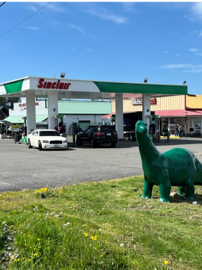 Sinclair gas station fueling island and DINO statue.