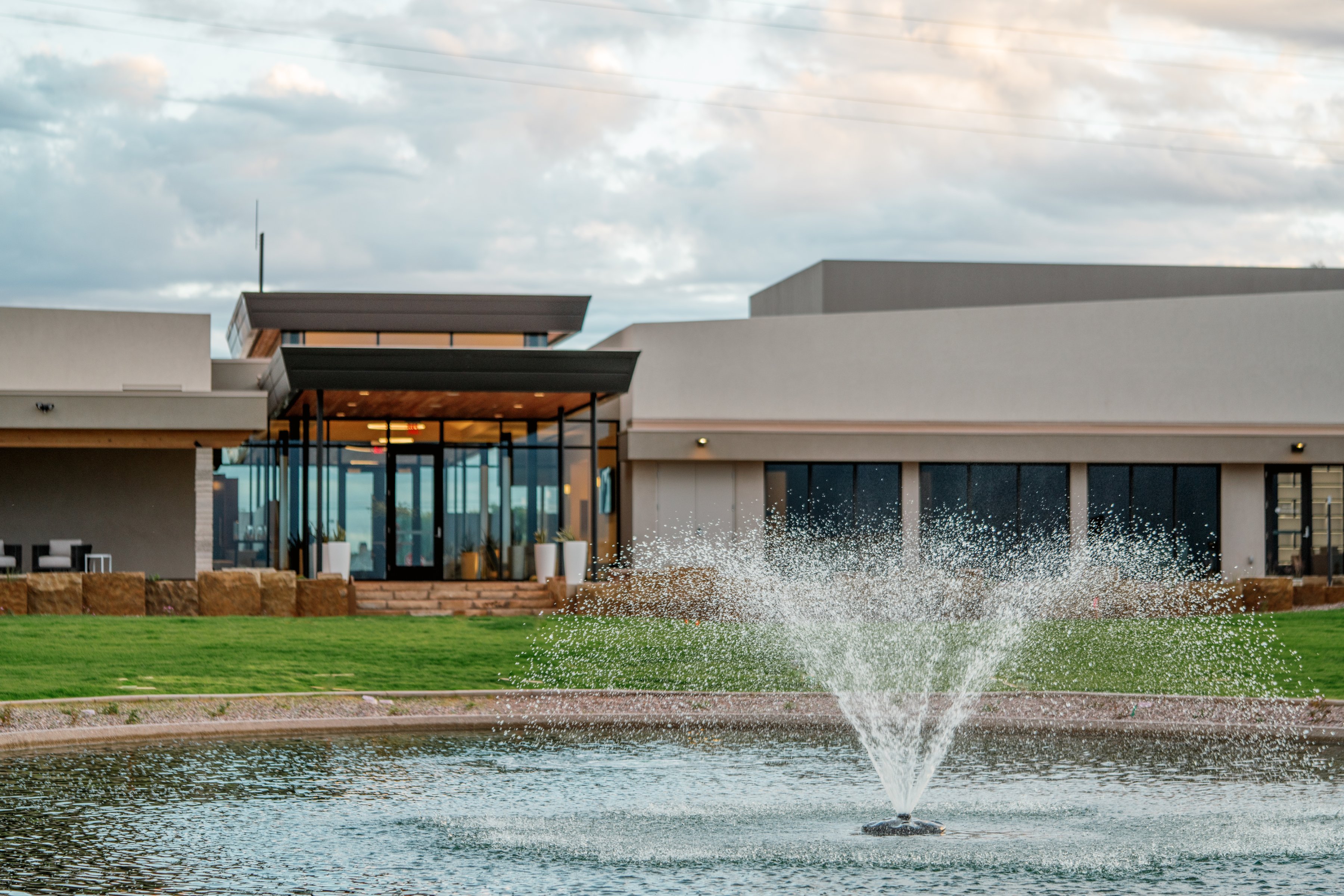 The fountain pond sits in front of the main building at Gilbert Memorial Park in Gilbert, AZ.