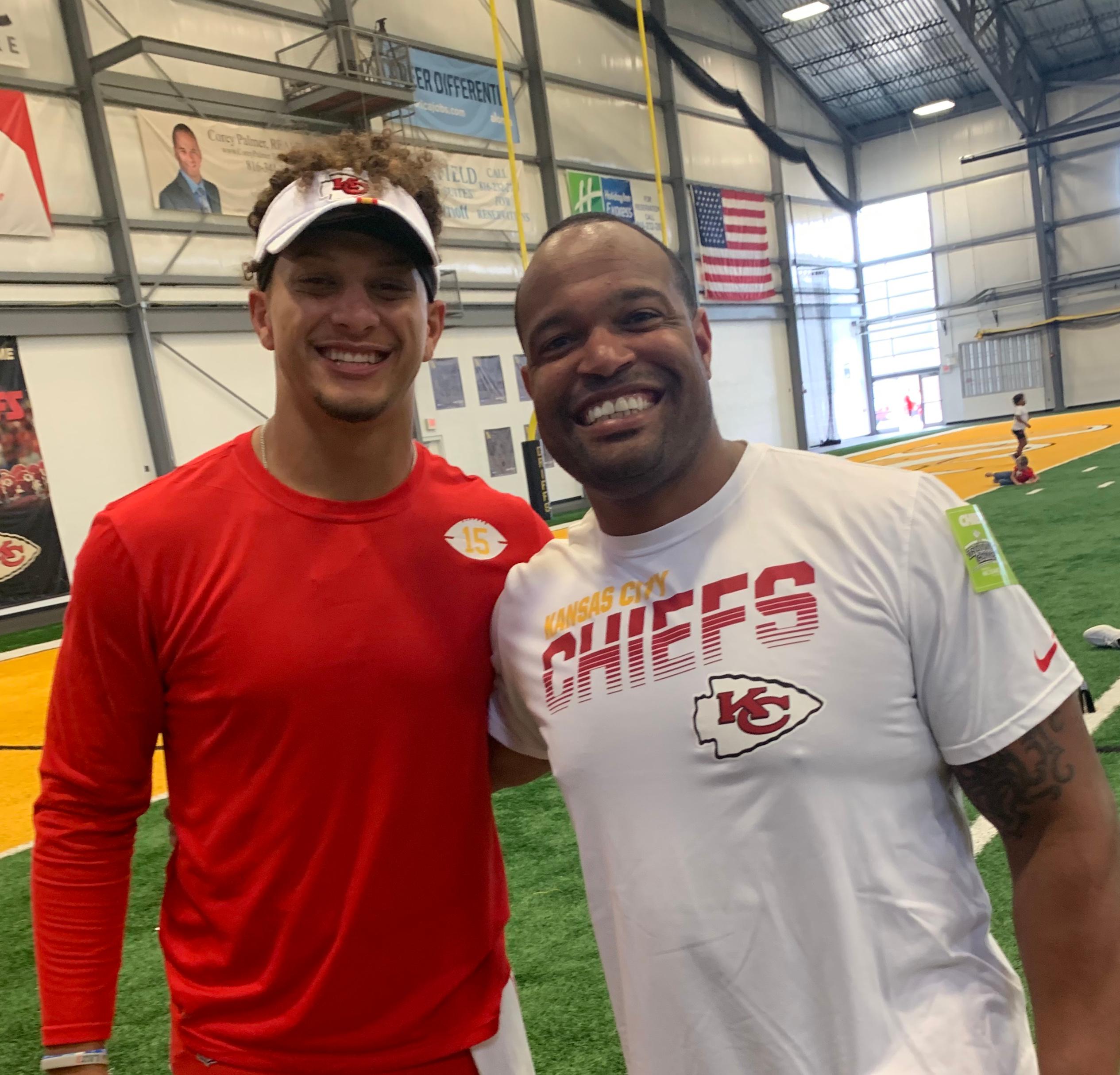 Patrick Mahomes with his dog trainer