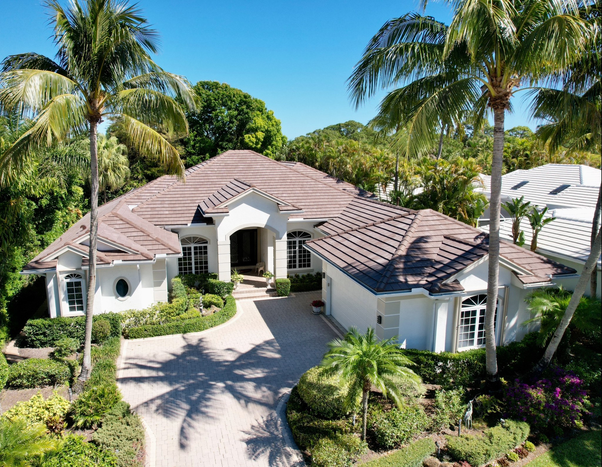 We replaced this roof with a flat tile from Eagle. This color is called Cocoa Range.