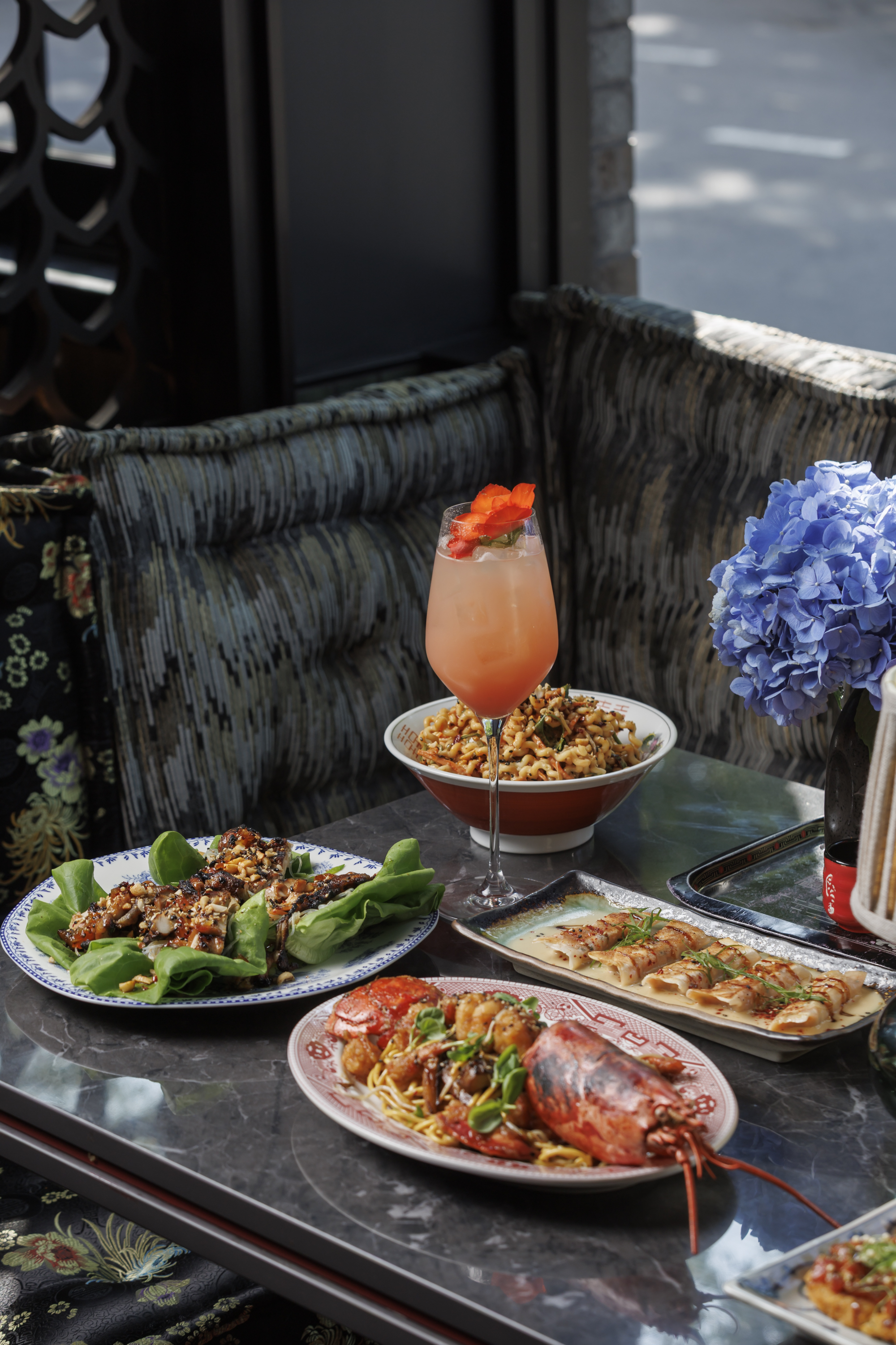Discover Mr. H in Boston’s Seaport District, featuring Ginger Scallion Lobster, Smoked Chicken Teriy 