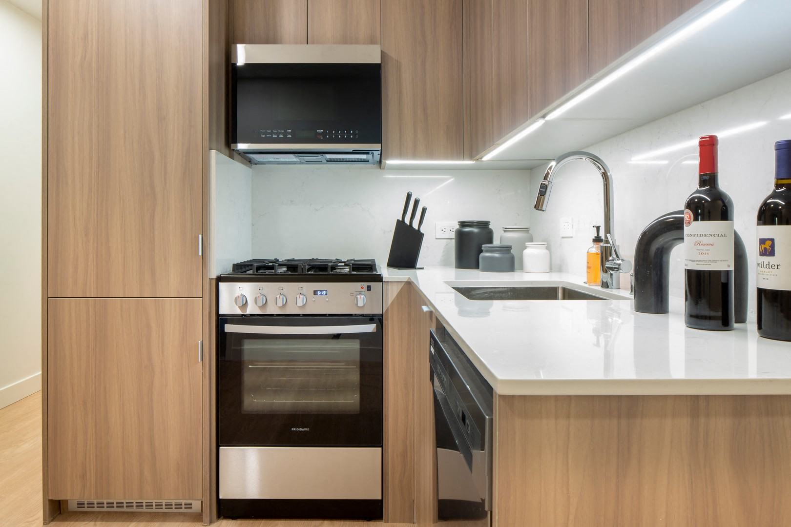 a kitchen with a stove and a sink