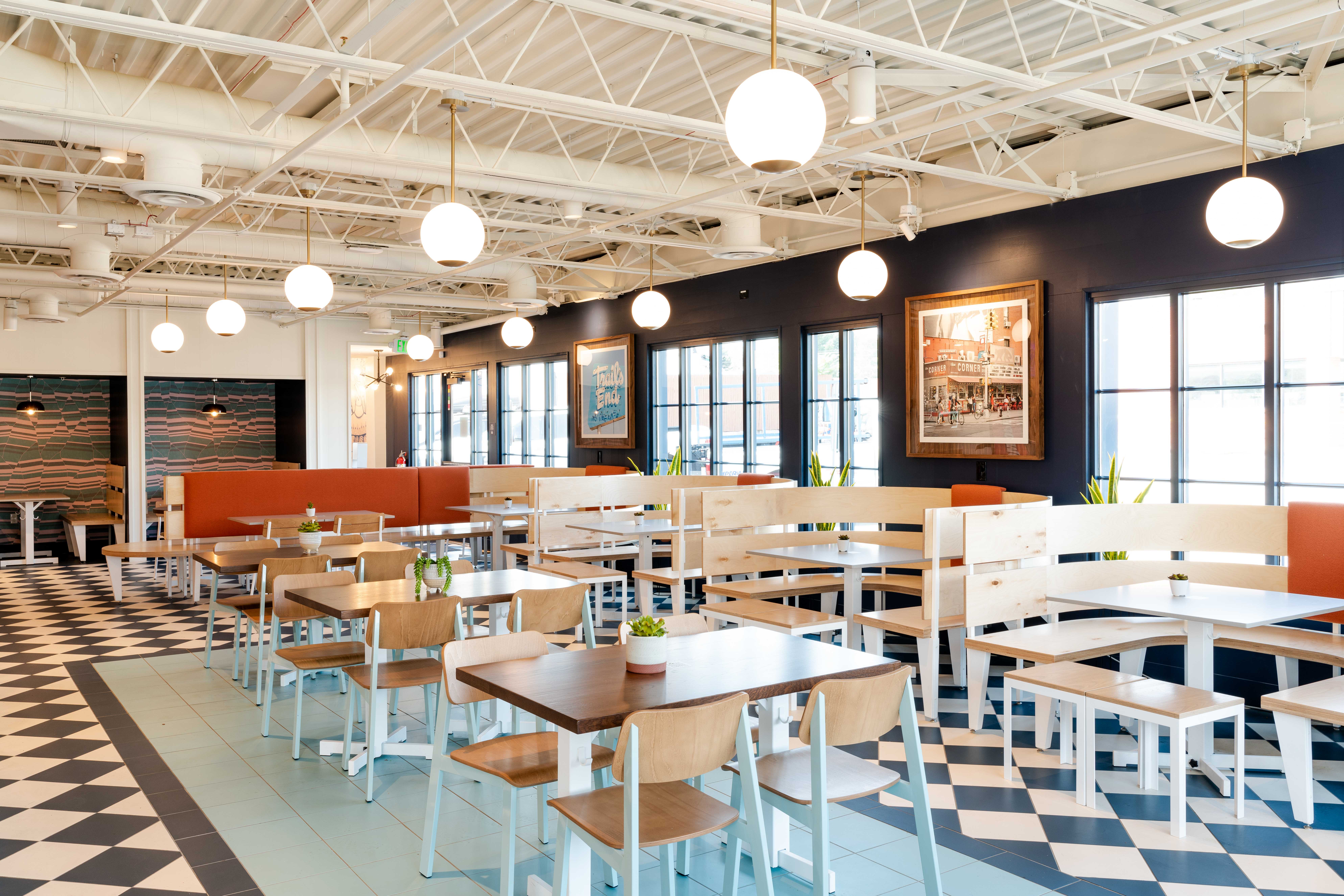Interior of Birdcall Cherry Hills with vast seating options. Pick from a booth or a table.