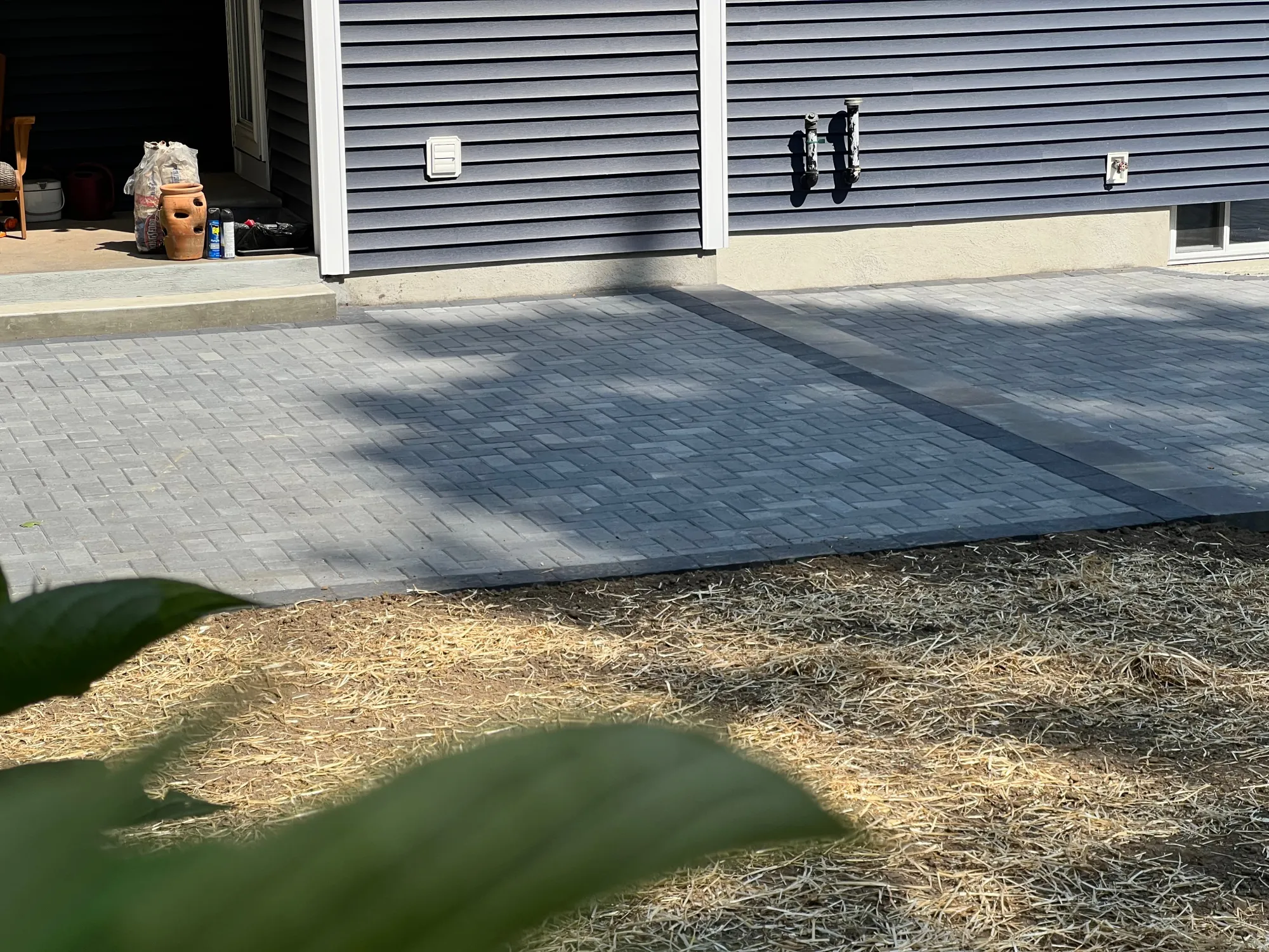 Completed backyard paver patio transformation in Trumbull CT - Multi-Layered Paver Patio, Trumbull project by General Masonry LLC.