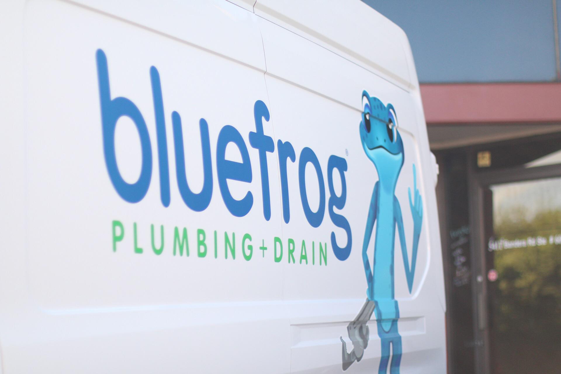 The bluefrog Plumbing + Drain logo on one of the plumbing service fleet vehicles.