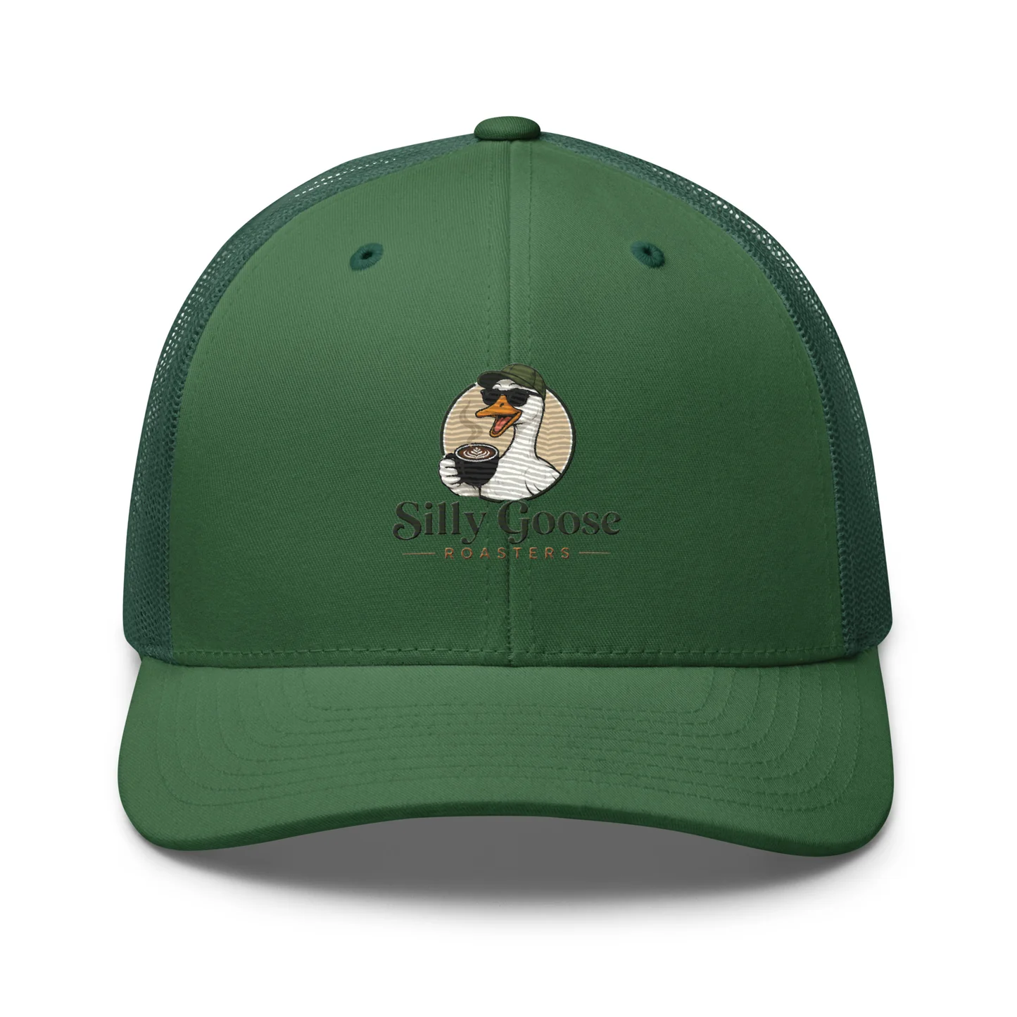 A dark green trucker hat with a mesh back and a logo on the front. The logo features a cartoon goose wearing sunglasses and a green cap, holding a cup of coffee with latte art. Below the goose, the text "Silly Goose ROASTERS" is displayed in an olive green font.