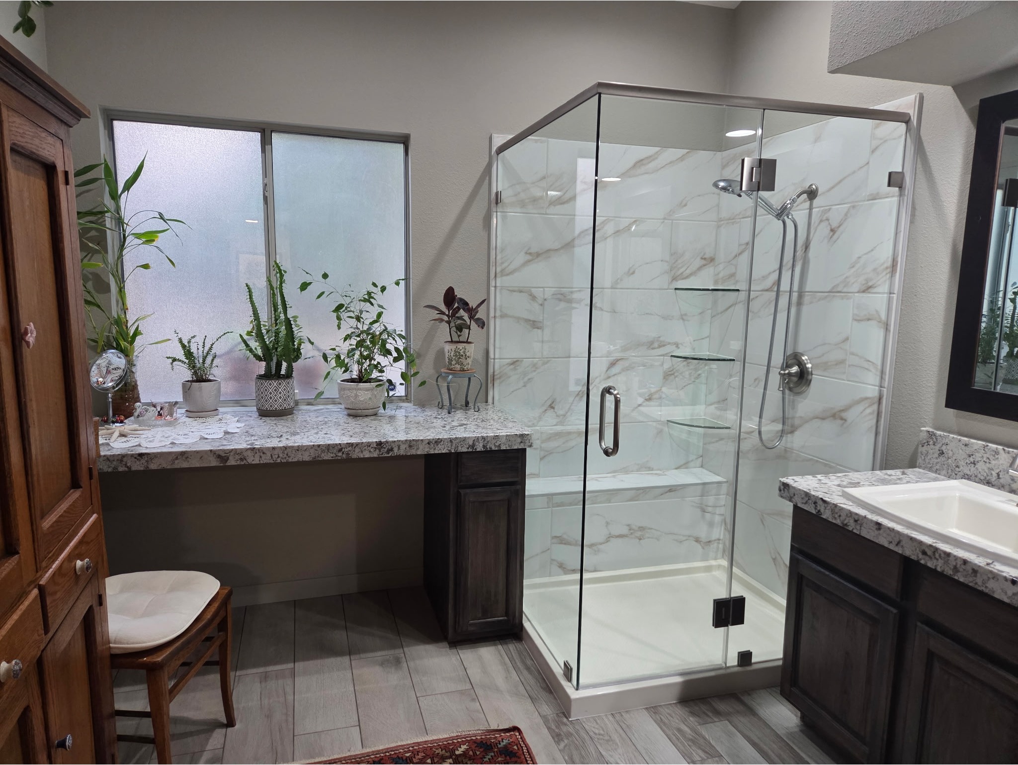 Transform your bathroom into a space you love. This custom bathroom remodel features marble-style tile, a frameless glass shower enclosure, granite countertops, and dark wood cabinetry — all designed and built by DV2 Pro Remodeling in Las Vegas. Planning a bathroom renovation? Call us today for a free estimate. (725) 425-7024
Request Free Estimate → https://dv2proremodeling.com/contact-us/