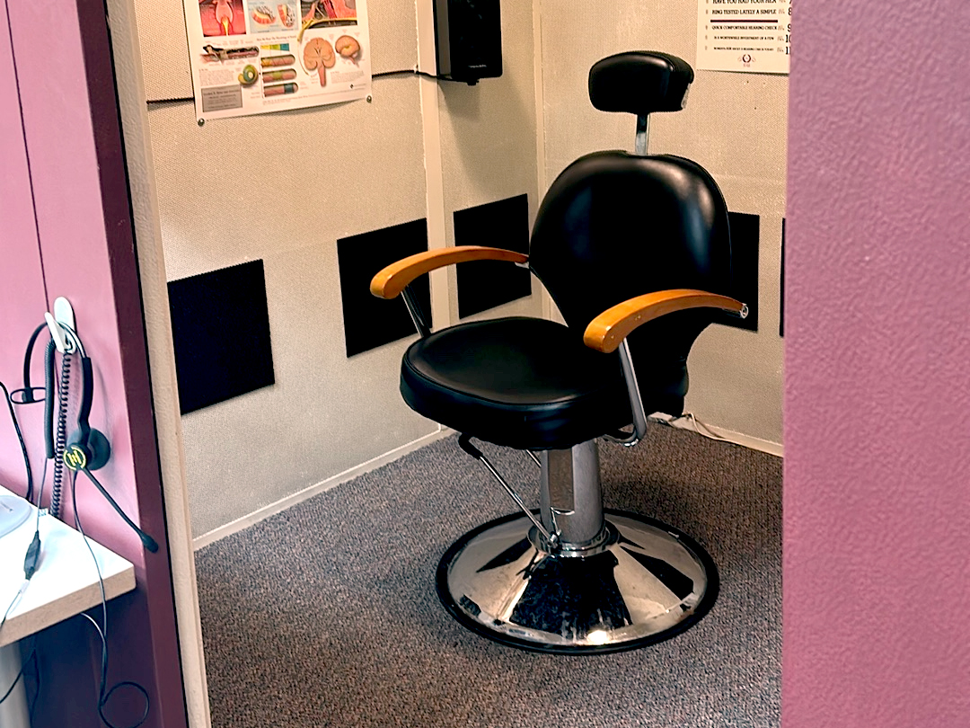 Interior photo of the hearing testing booth for AudioNova hearing clinic in Grand Rapids, MI