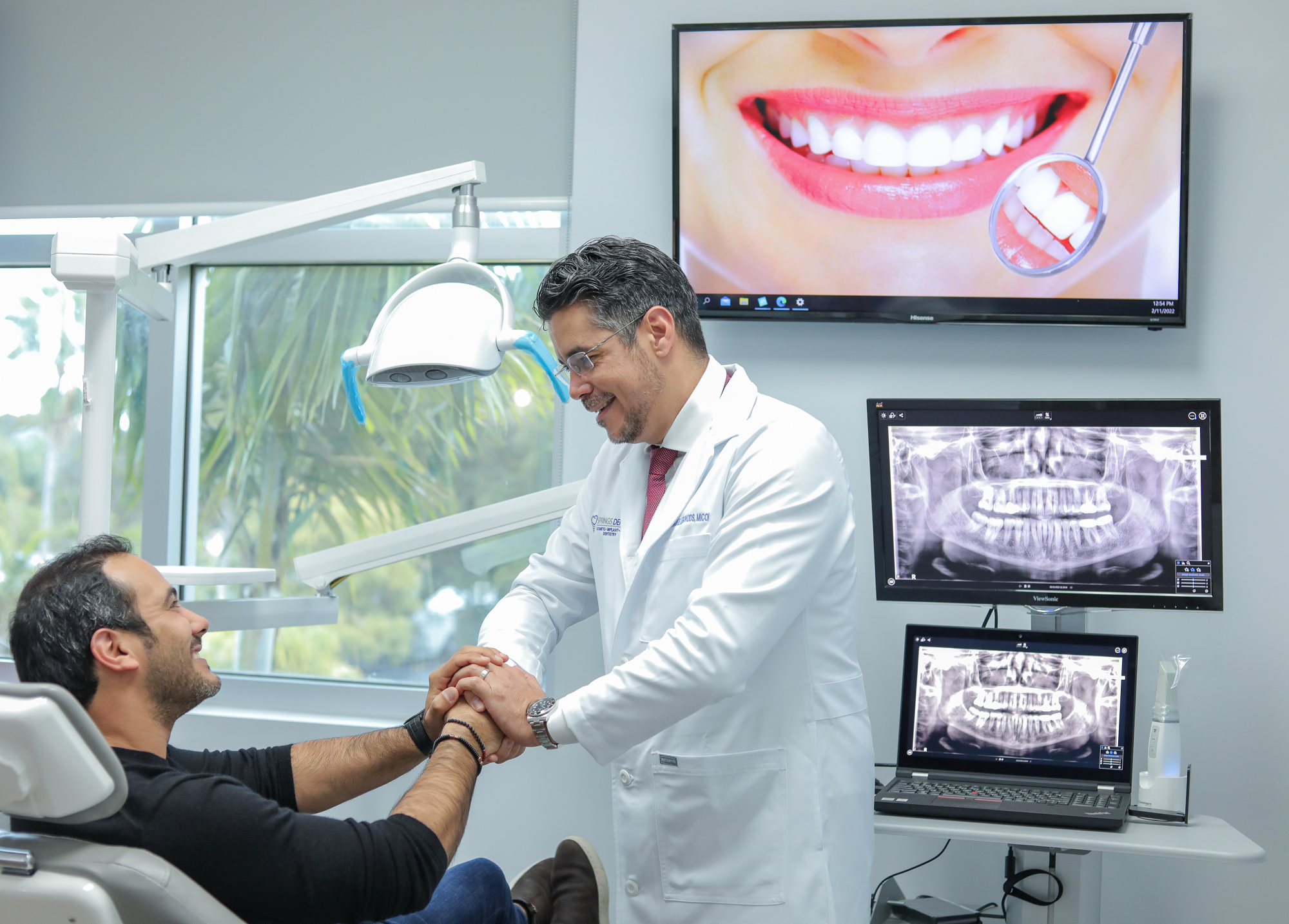 Dr. Enrique A Legon & Patient - Spring Dental