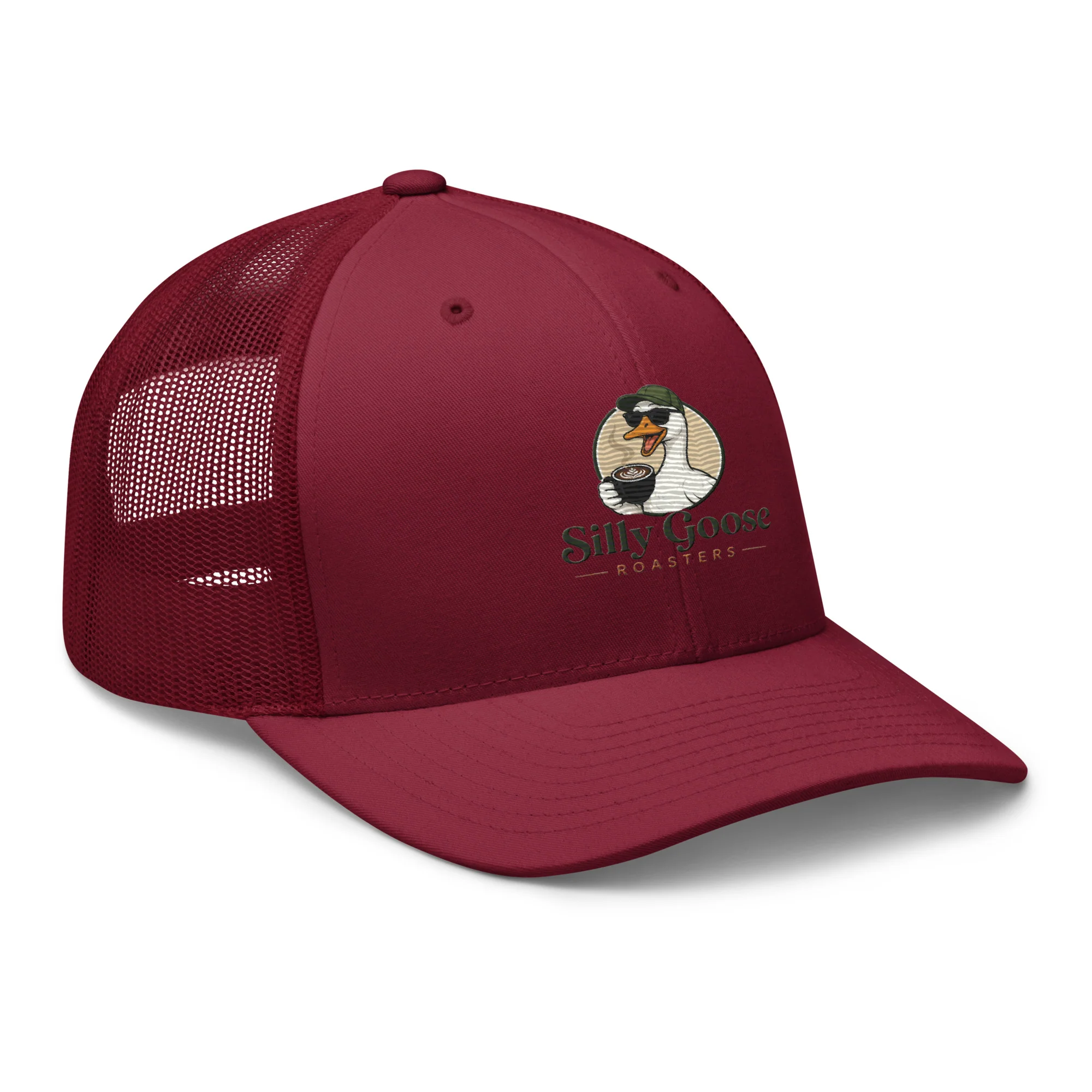 A maroon trucker hat with a mesh back, featuring a circular logo on the front. The logo depicts a cartoon goose wearing sunglasses and a hat, holding a cup of coffee with latte art. The text "Silly Goose ROASTERS" is embroidered below the goose.