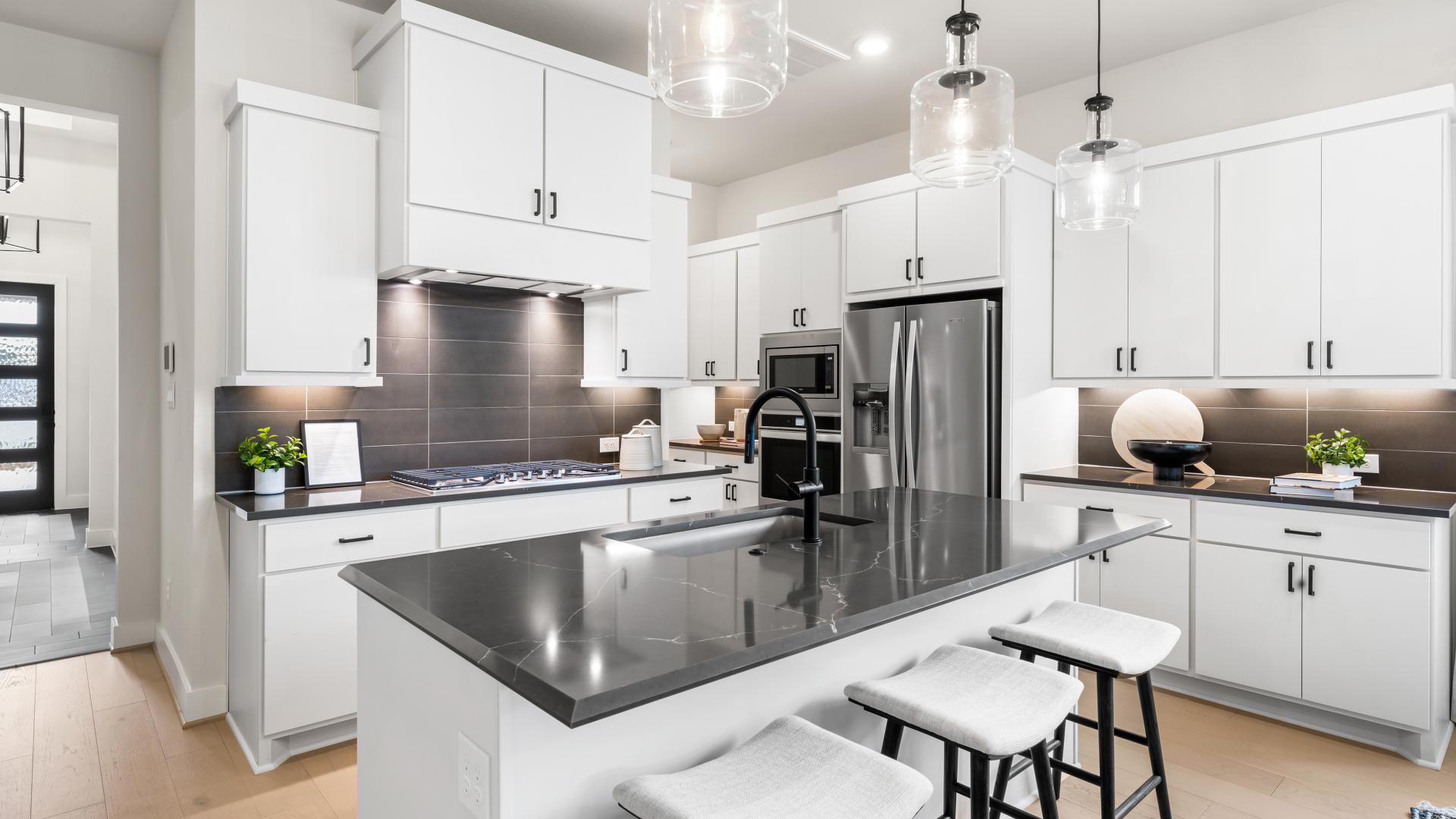 Gourmet kitchens with pendant lighting, islands and stainless steel appliances
