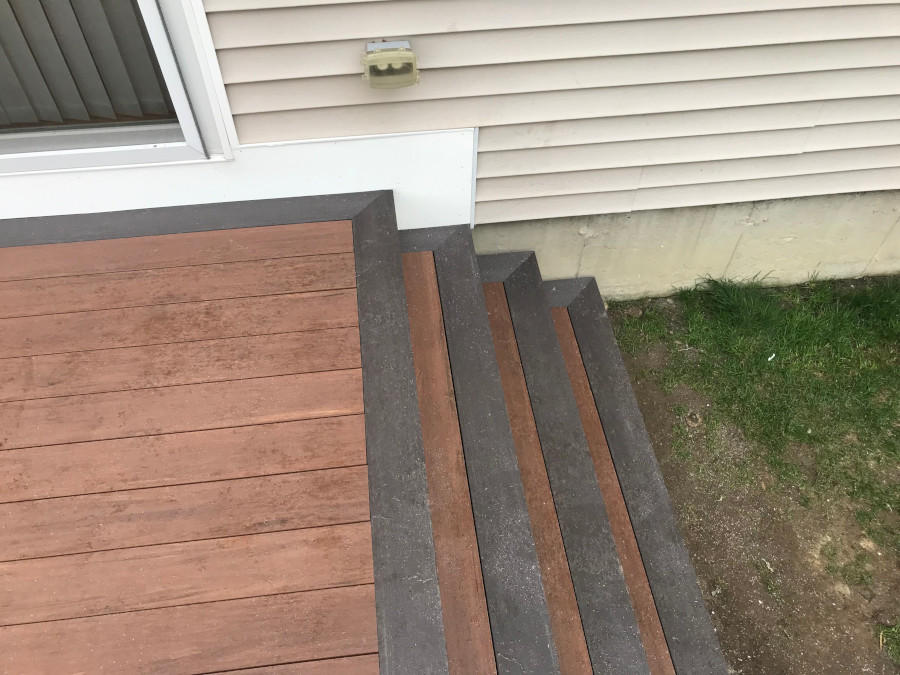 Our handyman traveled to Andover, MA for this residential project. This newly installed deck included a custom entryway under the deck and Timber Tec vinyl decking.