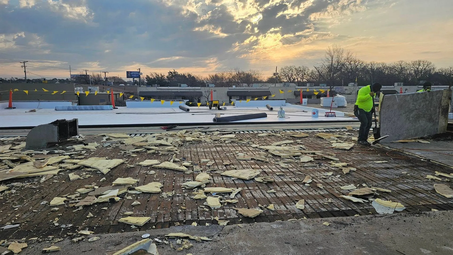 Commercial roof replacement project showing removed roofing materials and exposed deck before instal 