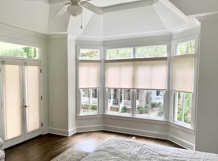 Create a cohesive look with our gorgeous roller shades! We love the way this local Hilton Head Island bedroom matched their custom roller shade design to create a uniform appearance between the shades on the doors and the window. Not only does this elevate the bedroom’s style, but it also provides a