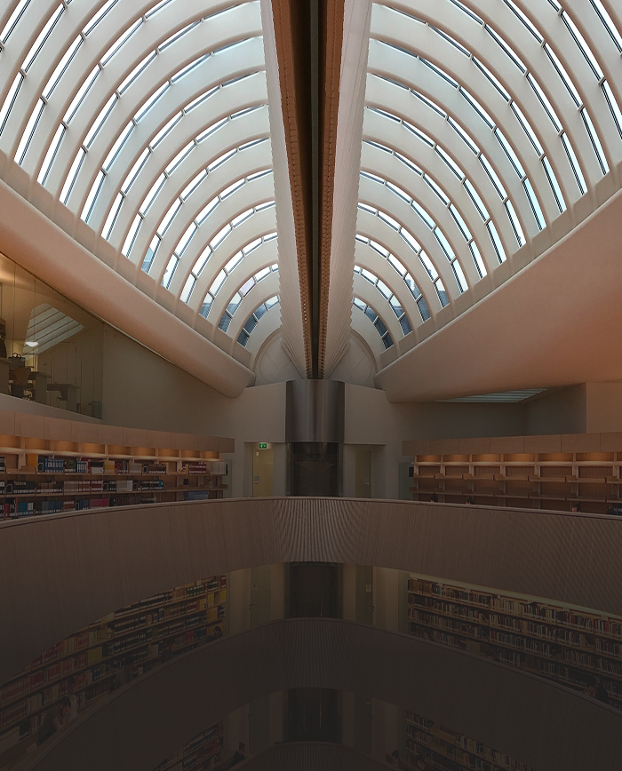 Modern, rounded library with a domed ceiling.