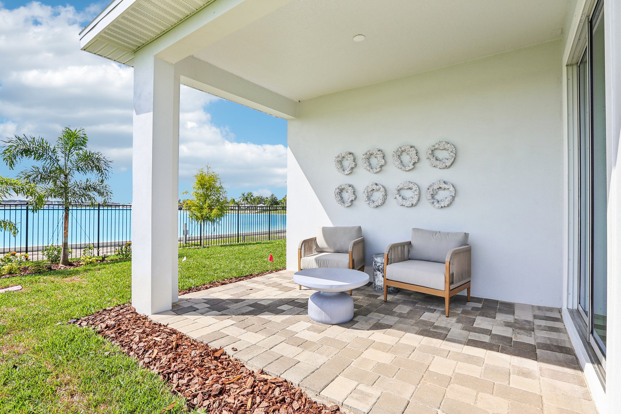 The Covered Lanai of a DRB Homes Bimini Home Plan at Isla Mirada in San Antonio, FL. 