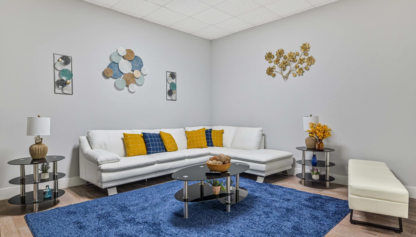 A shared common area at Sprout Recovery's Fort Myers facility, offering space for group time, relaxation, and connection between clients during treatment.