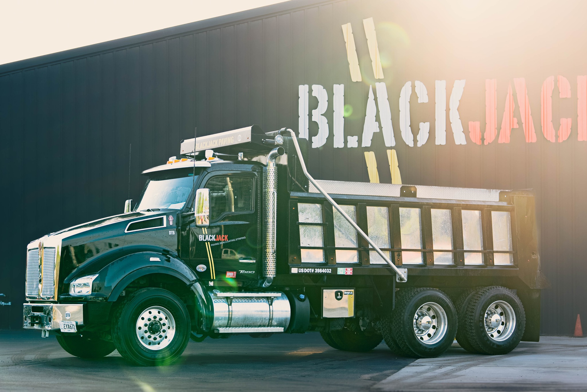 Sunset beaming down on a Blackjack Paving Work Truck