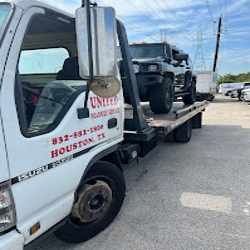 United Roadside Service safely transports a Jeep on a professional flatbed tow truck, ensuring secure loading, careful vehicle handling, dependable transportation, reliable roadside assistance, and trusted towing throughout Houston, Texas.
