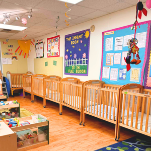Childcare Network teacher guiding young children through an activity using the HighReach Learning Curriculum