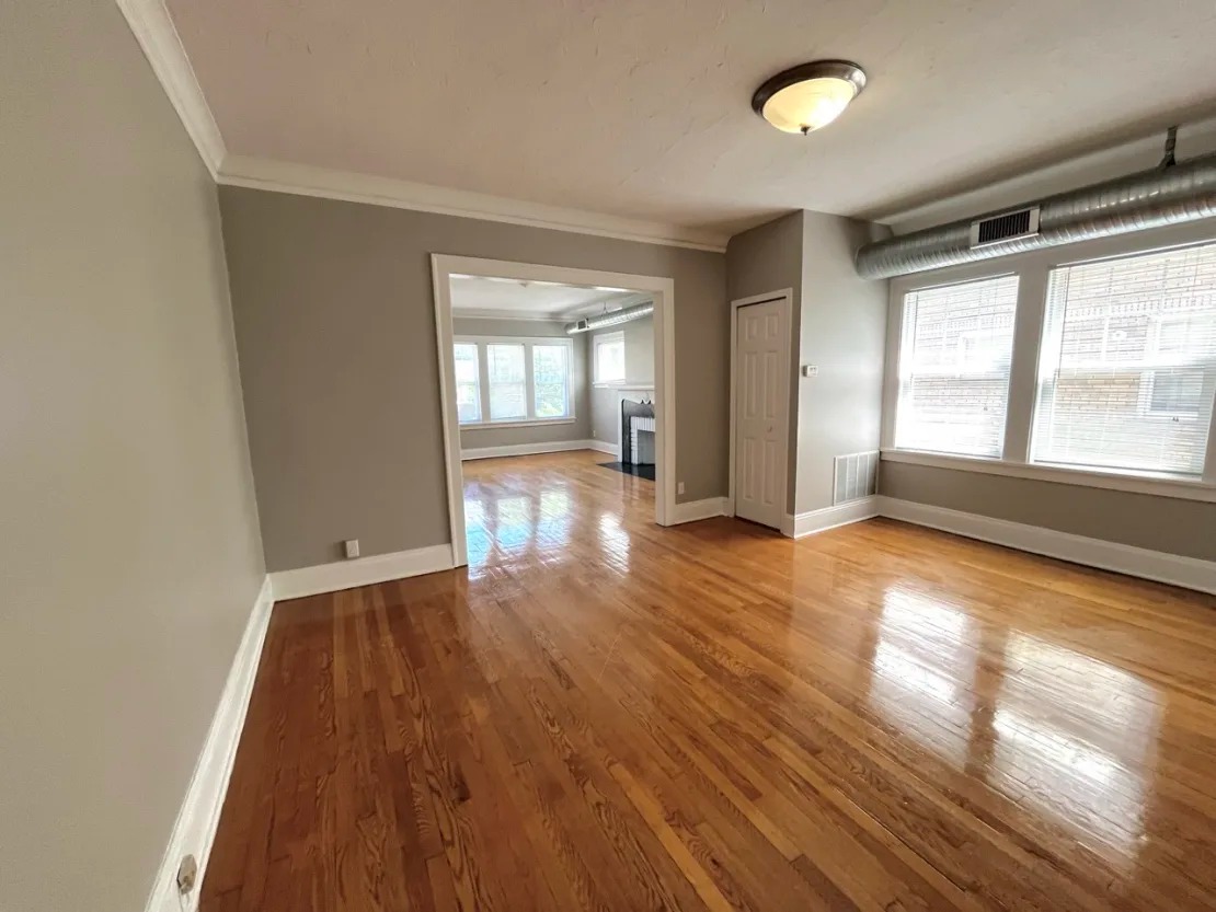 Empty living room with wood floors