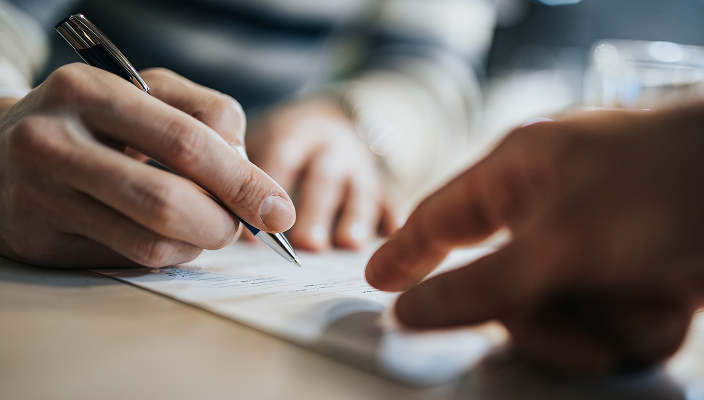Close-up of someone writing.