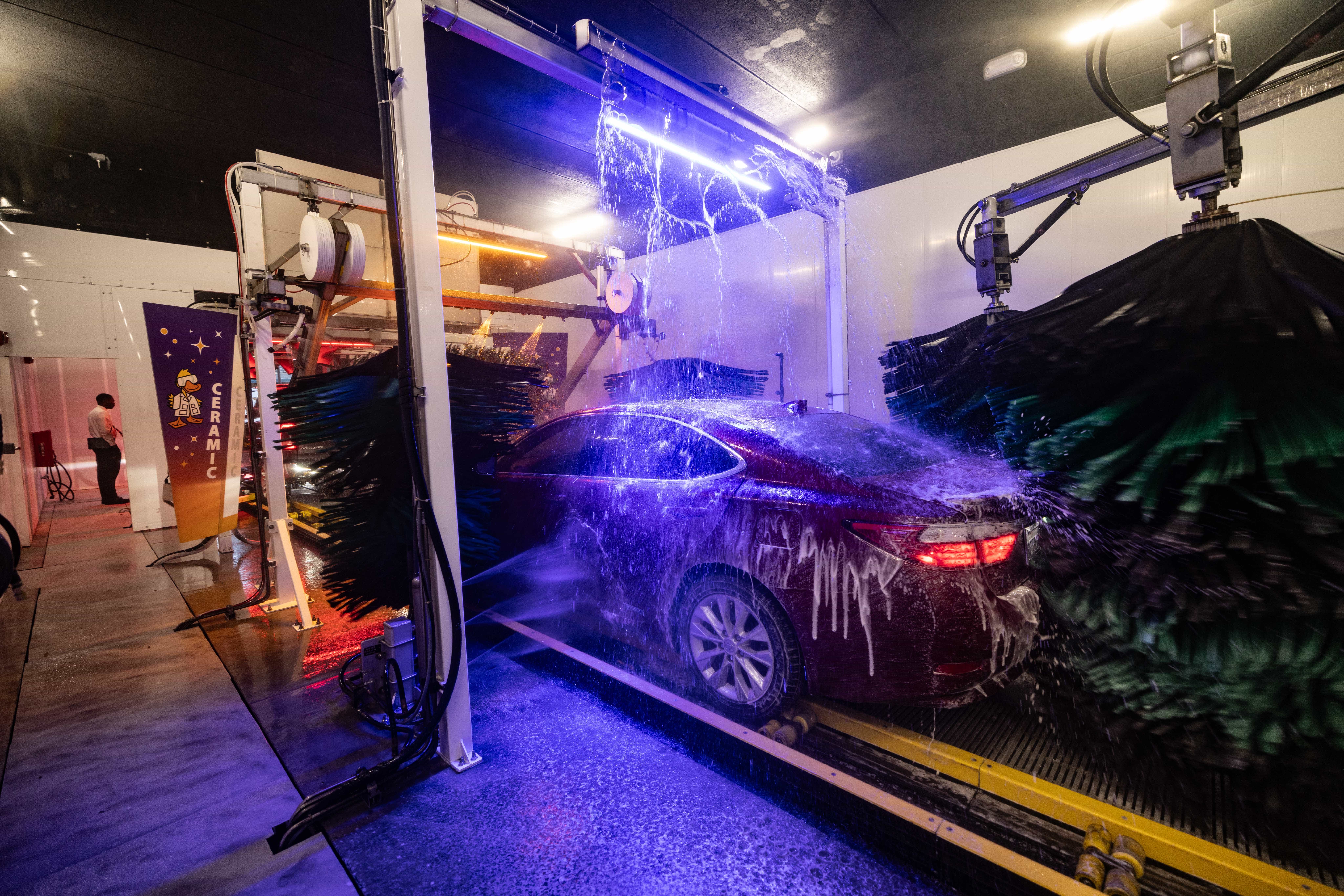 Quick Quack Car Wash's premium Ceramic wash package uses advanced UV treatment and professional-grade foam to protect and clean your vehicle inside our modern express wash tunnel.