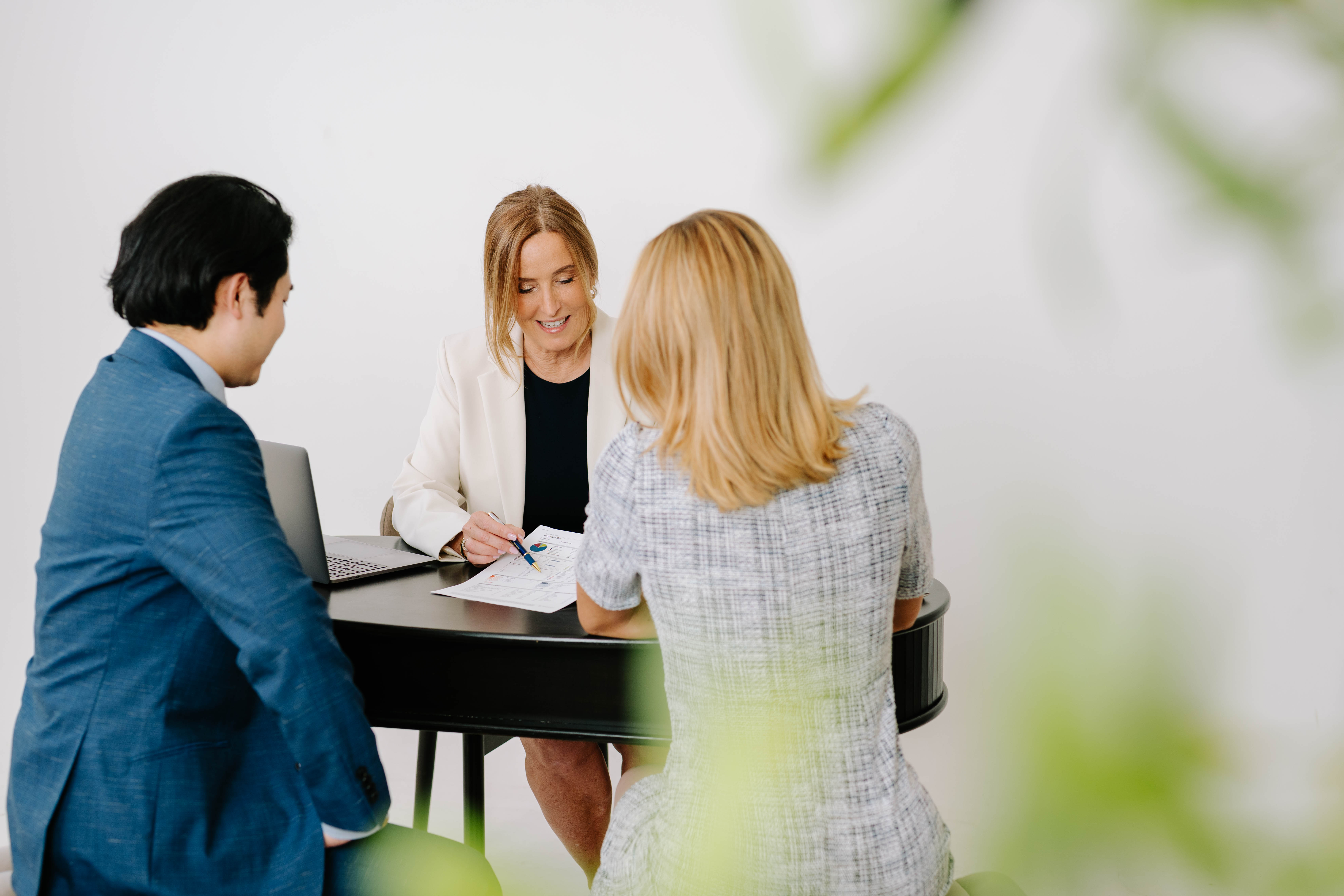 the Domaratzki Wealth Management team working at a table