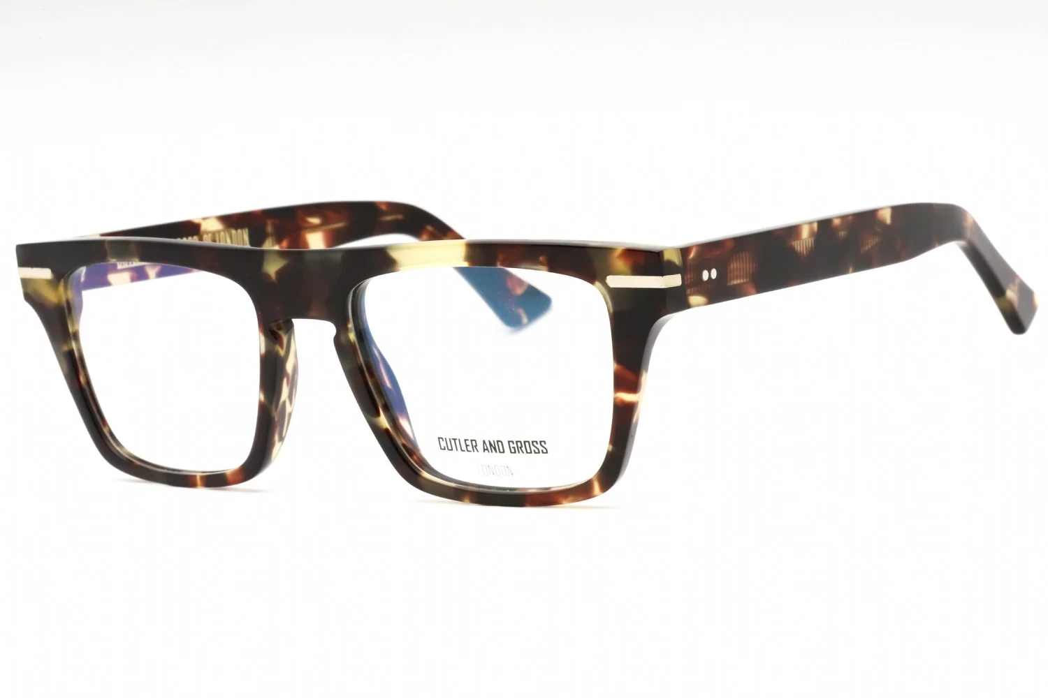 A close-up studio shot of a pair of Cutler and Gross eyeglasses with a tortoiseshell pattern. The glasses are presented against a plain white background. The frames are thick and rectangular, with a distinct tortoiseshell pattern in shades of brown, amber, and black. A small metallic detail is visible on the temple and bridge of the glasses, and two small dots are present on the front of the frame. The brand name 'CUTLER AND GROSS' and 'LONDON' are subtly printed in white on the inside of the right lens.