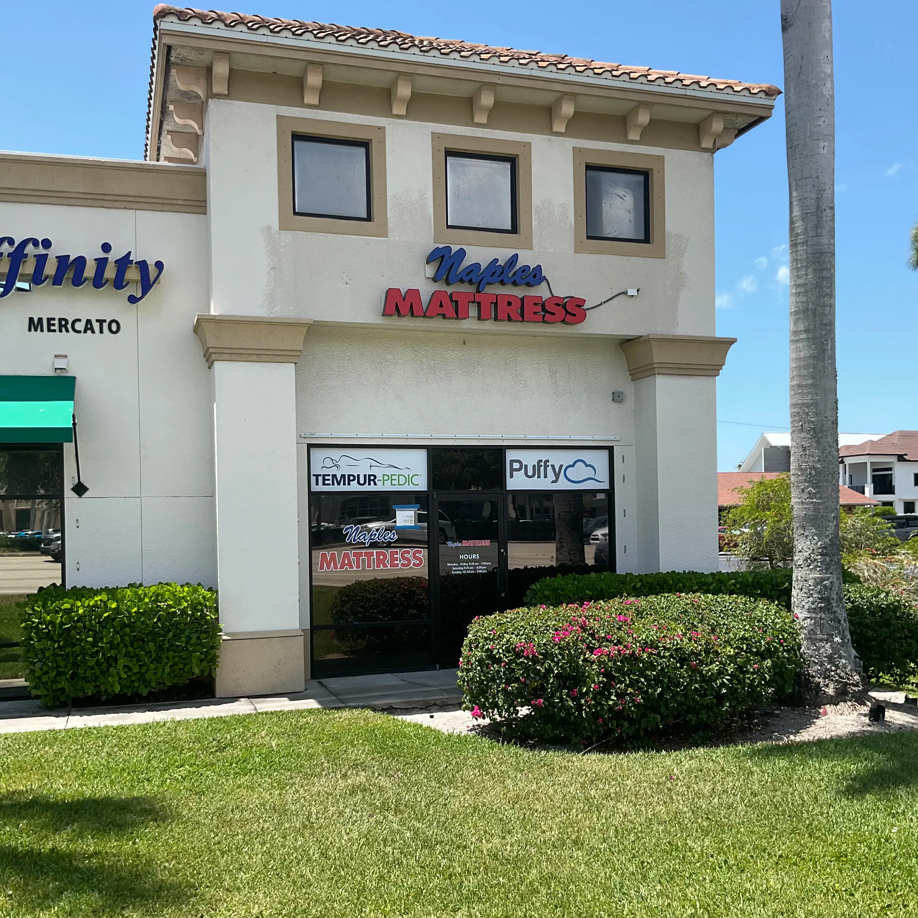 Front exterior of Naples Mattress North, showing the storefront signage and main entrance.