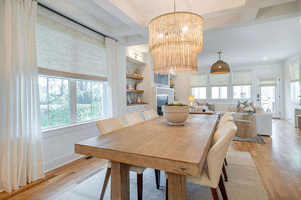 Woven wood shades and drapery are the perfect combo for making any dining room look sleek and stylish. Our team at Budget Blinds of Rockwall, Terrell, and Greenville can help you find the perfect combo that fit your space.