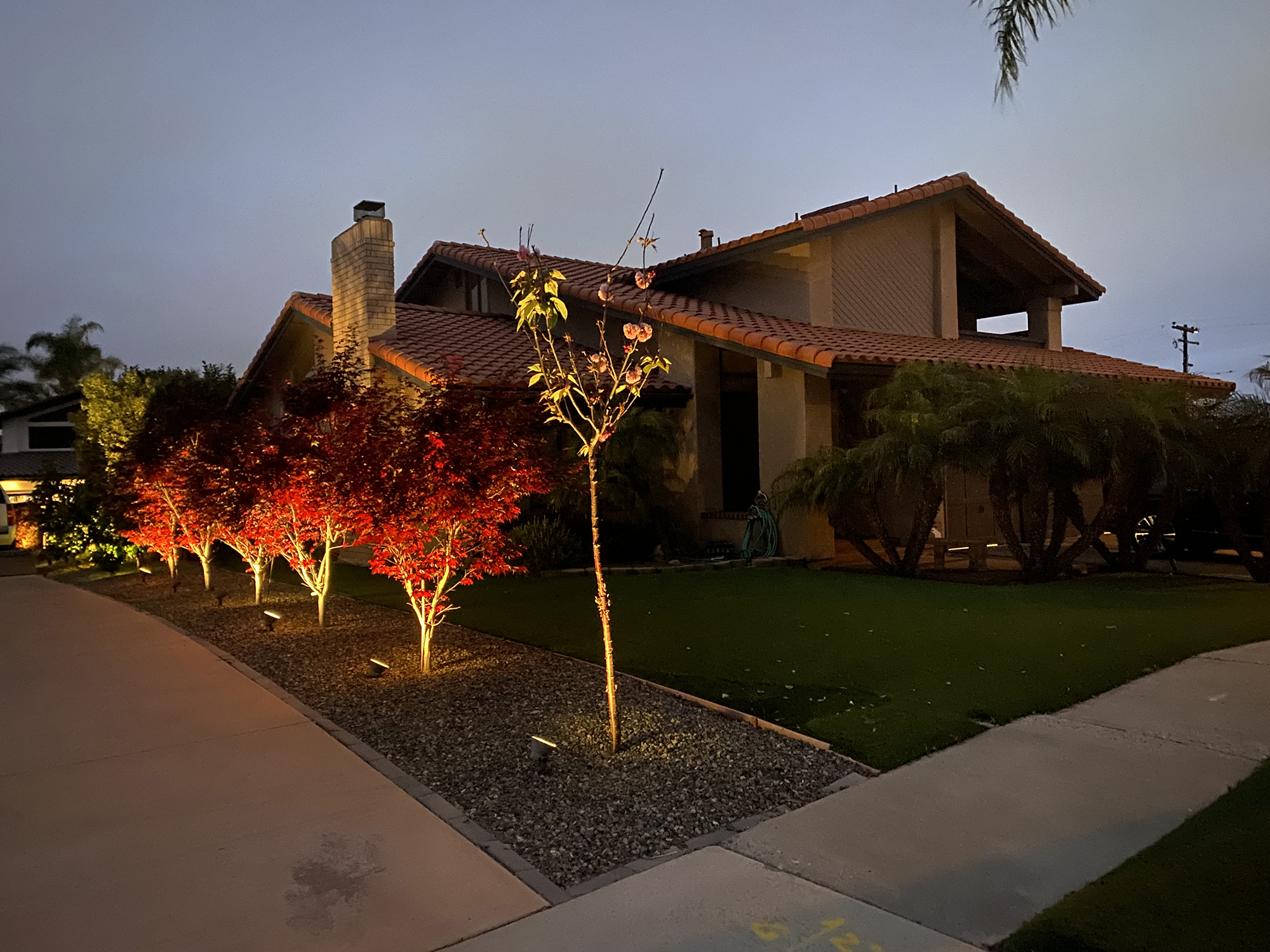 Entrance to a serene residential recovery center, nestled among trees for privacy and tranquility.