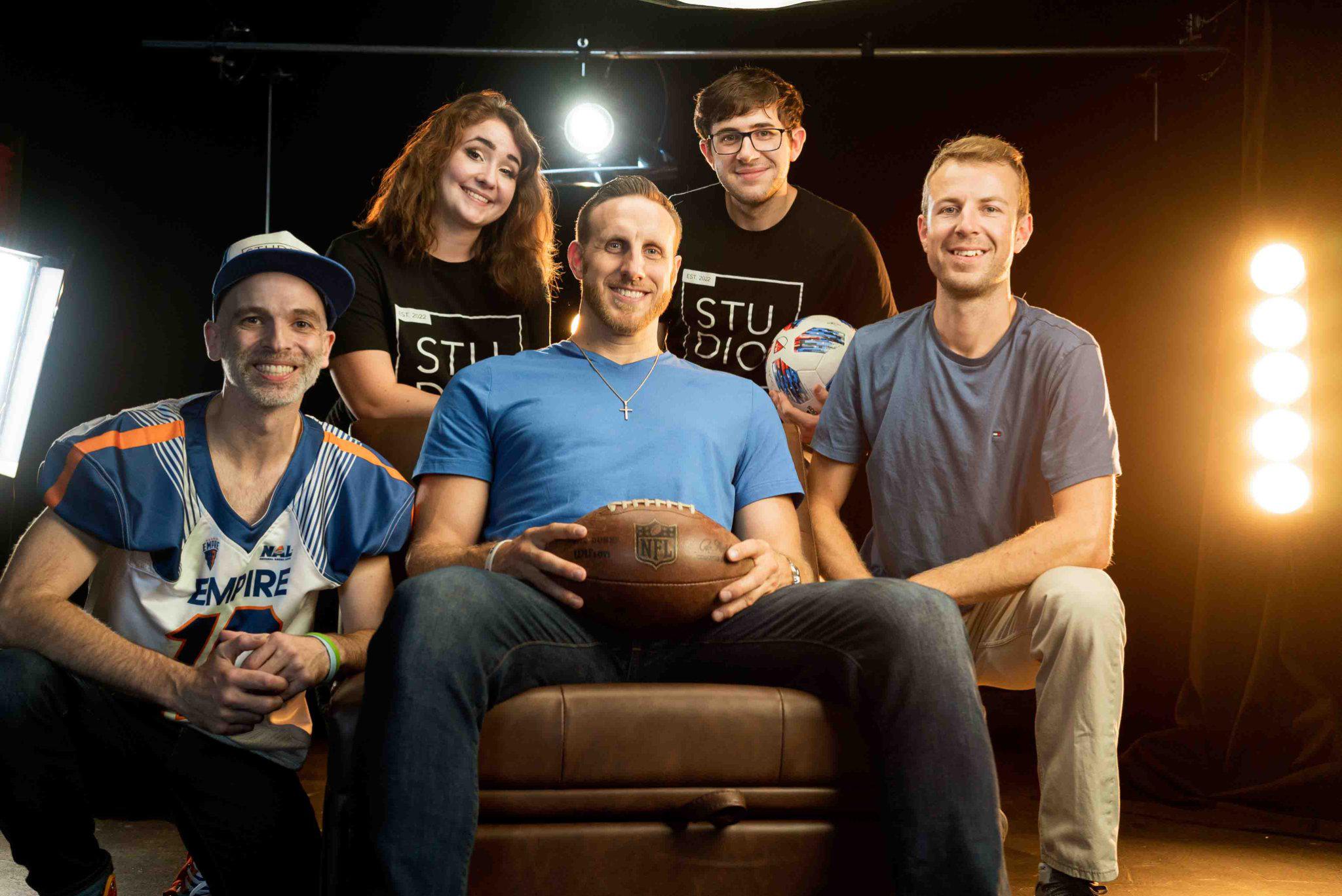 The film crew of Akullian Creative's Studio A posing after a film shoot with Craig Peterson during their documentary production.