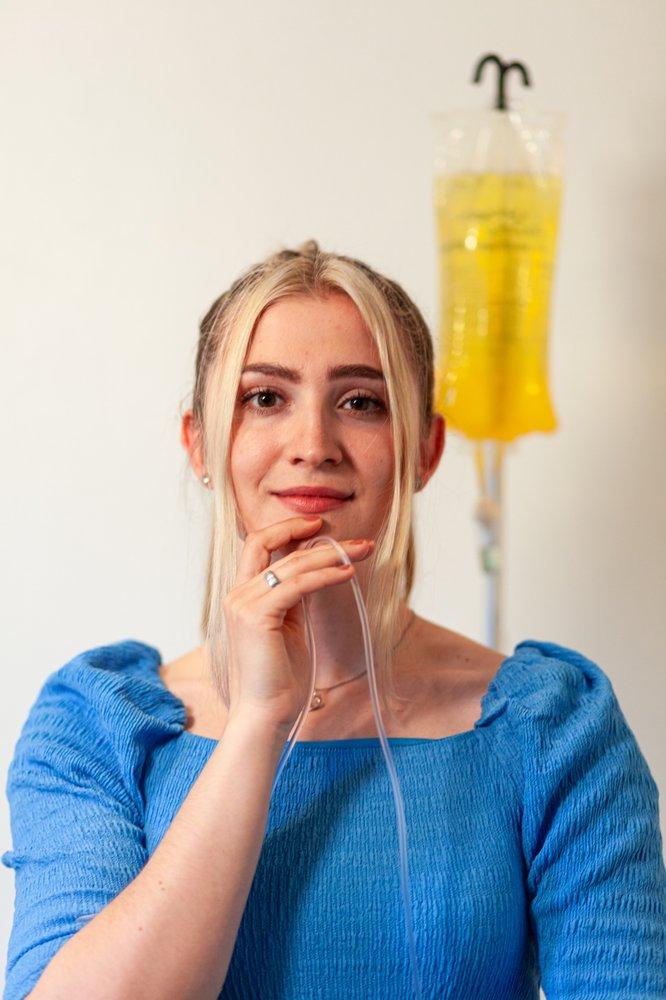Young woman receiving mobile IV therapy in Los Angeles for hydration and wellness.