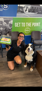 Jeanne celebrating her anniversary with Apollo at Walker Tire Point S in Downtown Lincoln. 