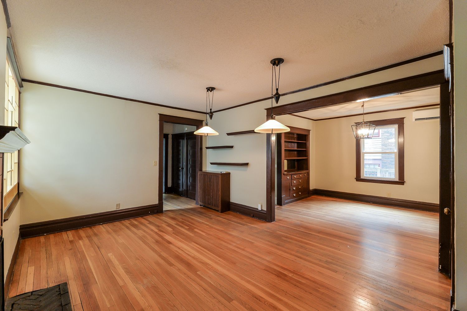 Beautiful living space with wood flooring and dining area at Invitation Homes Minneapolis.