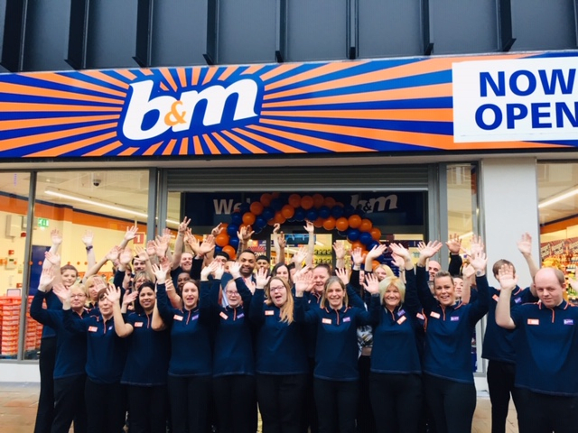 The store team at B&M's newest store in Wolverhampton pose in front of their wonderful new B&M Store, located in the city centre at the Mander Centre.